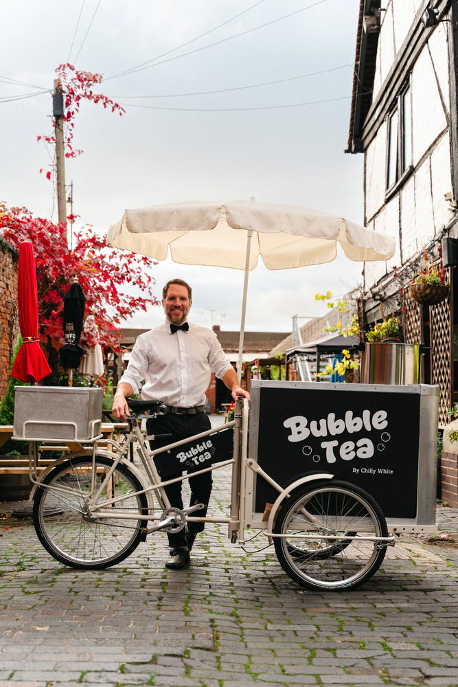 Refreshing bubble tea bike cart by Chilly White in an outdoor urban setting.